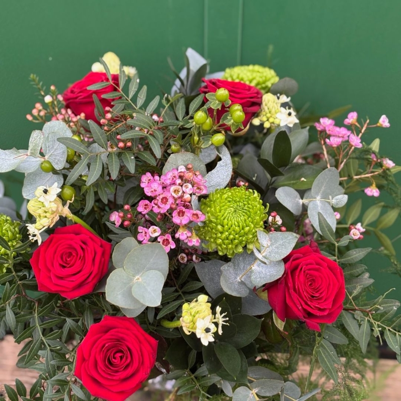 Lover Valentine’s Day bouquet featuring red roses and seasonal foliage, available for flower delivery in Darlington.