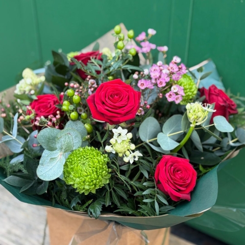 Lover Valentine’s Day bouquet featuring red roses and seasonal foliage, available for flower delivery in Darlington.