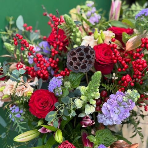 Christmas bouquet with berries and roses available for delivery before Christmas 