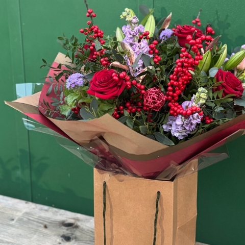 Christmas bouquet with berries and roses available for delivery before Christmas 